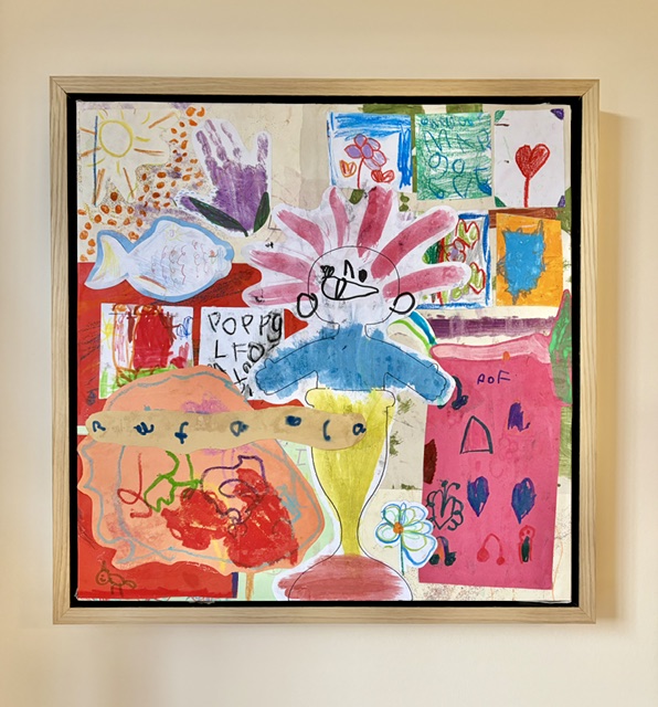 Bespoke children's art collage in light oak frame on wall