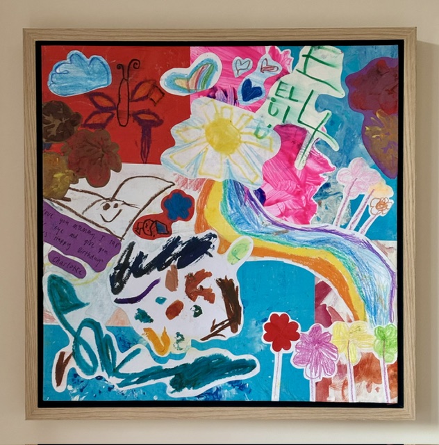 Colourful children's artwork collage framed