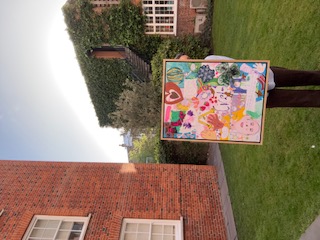 Large bespoke children's art collage framed in light oak